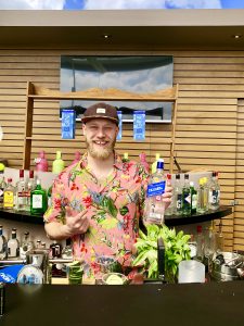 Bartender showing off Joyouth bottle